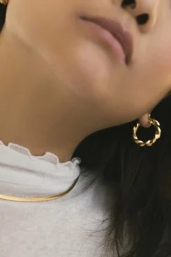 Dipua Argola Bruli em Ouro - Design Intrigante com um Toque de Modernidade